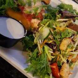 The Greene Turtle Sports Bar & Grille - Spicy jack burger with a side salad