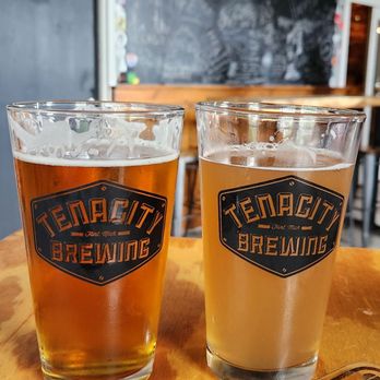 Tenacity Brewing - two glasses of beer on a table - Breweries Near Me - Flint, Michigan Tenacity Brewing - two glasses of beer on a table - Breweries Near Me - Flint, Michigan
