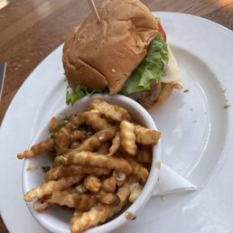 Grilled chicken burger and cup of poutine Grilled chicken burger and cup of poutine