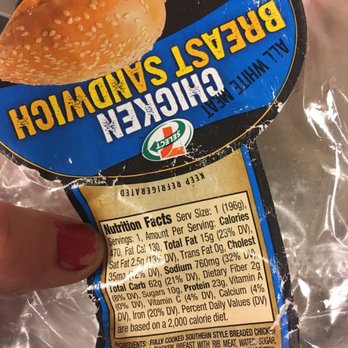 7-Eleven - a hand holding a bag of bread sandwich - Convenience Stores Near Me - Tustin, California 7-Eleven - a hand holding a bag of bread sandwich - Convenience Stores Near Me - Tustin, California