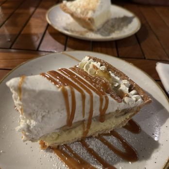 Monkeypod Kitchen - Banana cream pie in front and coconut cream in back. - Hawaiian Near Me - Kapolei, Hawaii Monkeypod Kitchen - Banana cream pie in front and coconut cream in back. - Hawaiian Near Me - Kapolei, Hawaii