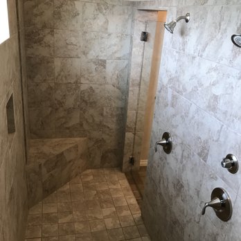 Symphony Homes - a walk - in shower with a tiled floor - General Contractors Near Me - Salado, Texas Symphony Homes - a walk - in shower with a tiled floor - General Contractors Near Me - Salado, Texas