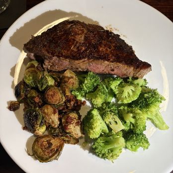 Back Room Steakhouse - 16oz new york strip with broccoli and bacon crusted brussels sprouts - Steakhouses Near Me - Apopka, Florida Back Room Steakhouse - 16oz new york strip with broccoli and bacon crusted brussels sprouts - Steakhouses Near Me - Apopka, Florida