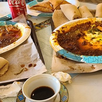 Zemeta Ethiopian Restaurant - two plates of food on a table - Ethiopian Near Me - Rochester, New York Zemeta Ethiopian Restaurant - two plates of food on a table - Ethiopian Near Me - Rochester, New York