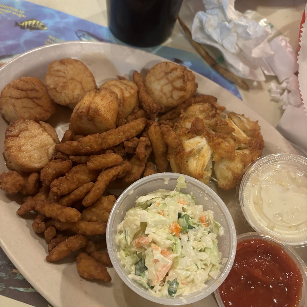 Fried clams, crab cake, and scallops. Fried clams, crab cake, and scallops.