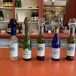 a row of bottles of wine a row of bottles of wine