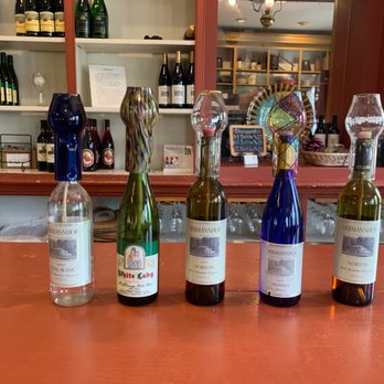 Hermannhof Winery - a row of bottles of wine - Wineries Near Me - Hermann, Missouri Hermannhof Winery - a row of bottles of wine - Wineries Near Me - Hermann, Missouri