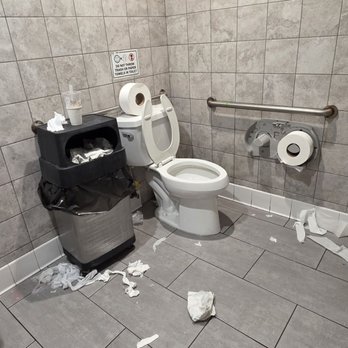 Bake & Che - Dirty restroom with overflowing trash, paper all over the floor, and a toilet area that looks completely unclean. - Desserts Near Me - Westminster, California Bake & Che - Dirty restroom with overflowing trash, paper all over the floor, and a toilet area that looks completely unclean. - Desserts Near Me - Westminster, California