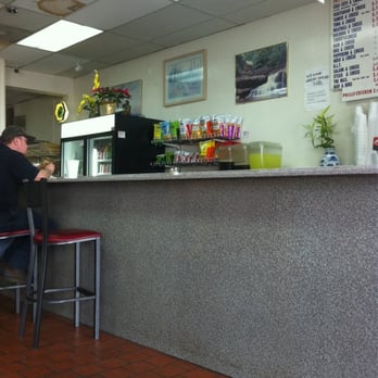 Sun's Sub & Pub - a man sitting at a counter - Restaurants Near Me - Portsmouth, Virginia Sun's Sub & Pub - a man sitting at a counter - Restaurants Near Me - Portsmouth, Virginia