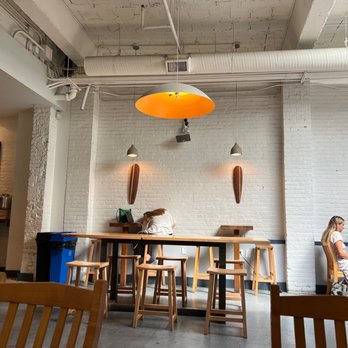 Slipstream - a woman sitting at a table in a restaurant - Coffee & Tea Near Me - Washington, DC, District of Columbia Slipstream - a woman sitting at a table in a restaurant - Coffee & Tea Near Me - Washington, DC, District of Columbia