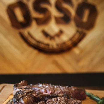 Osso - a piece of steak on a cutting board - Restaurants Near Me - Miami, Florida Osso - a piece of steak on a cutting board - Restaurants Near Me - Miami, Florida