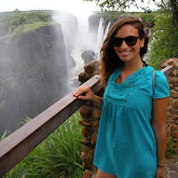 Esplanade Travel - Tess, our Travel Consultant, at Victoria Falls in Zambia. - Travel Services Near Me - Boston, Massachusetts Esplanade Travel - Tess, our Travel Consultant, at Victoria Falls in Zambia. - Travel Services Near Me - Boston, Massachusetts