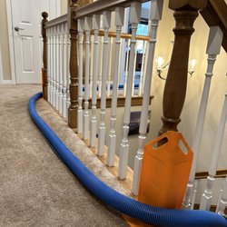 Efren's Carpet Cleaning - Corner protectors Efren uses prevents hose from marking up walls.
