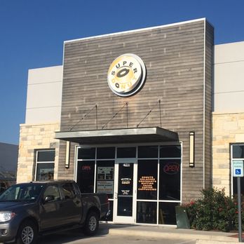 Grand Donut - a large clock on the side of a building - Donuts Near Me - Leander, Texas Grand Donut - a large clock on the side of a building - Donuts Near Me - Leander, Texas