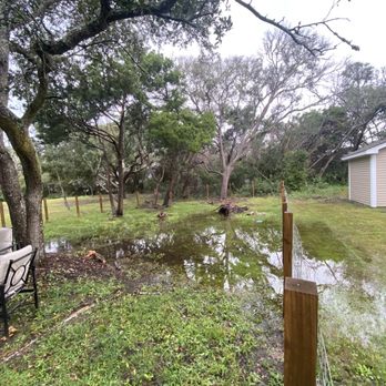 Better Beach Rentals - Back yard when it rained and flooded and the back yard was unusable - Vacation Rental Agents Near Me - Oak Island, North Carolina