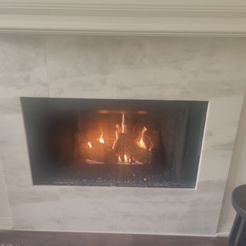 Pacific Fireside - Fireplace now works great and has new beautiful marble tile. - Chimney Sweeps Near Me - Los Angeles, California