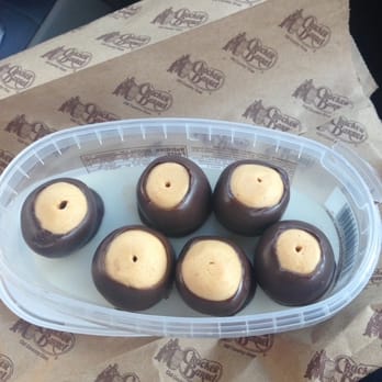 Marsha's Homemade Buckeyes - a plastic container filled with chocolate covered marshmallows - Candy Stores Near Me - Perrysburg, Ohio