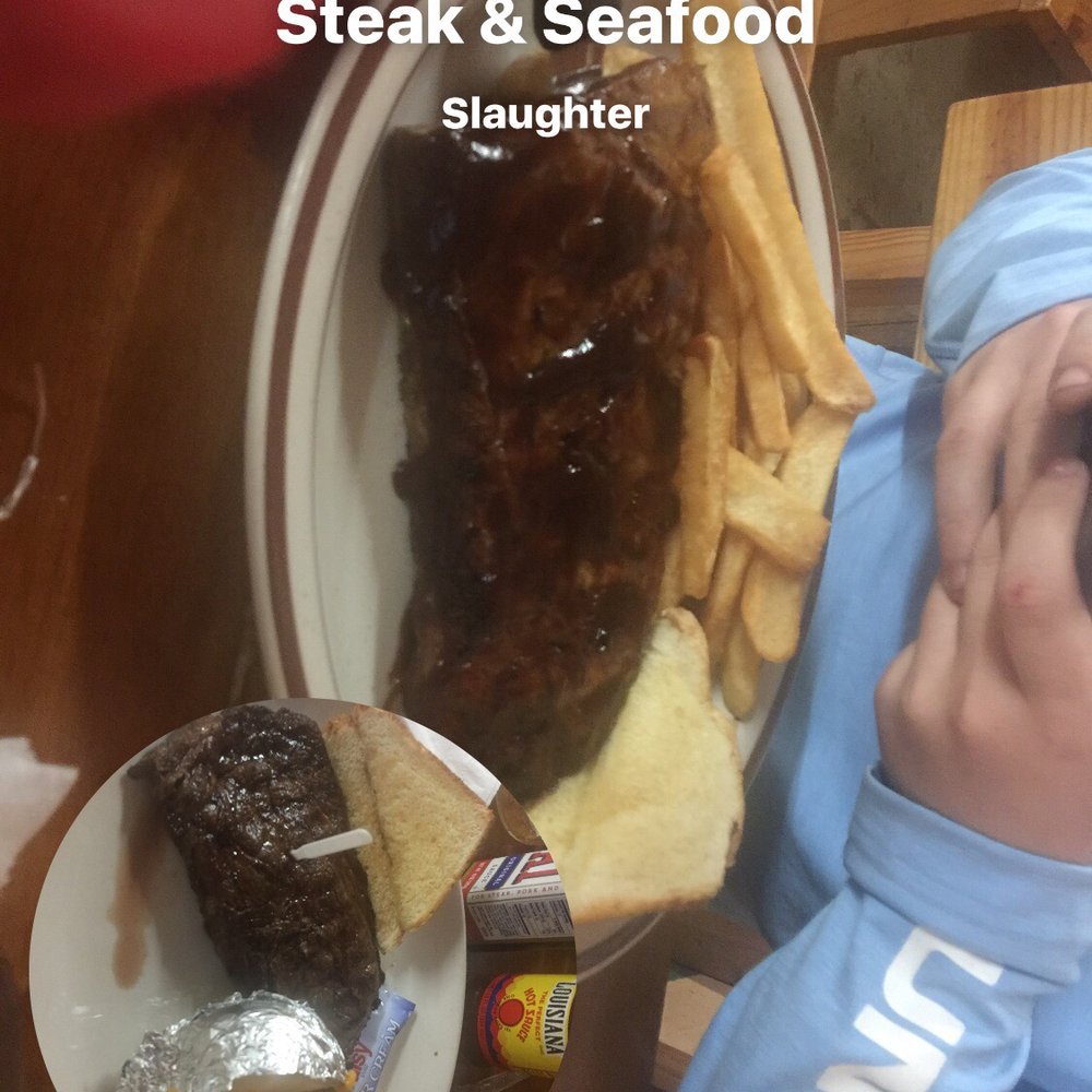 Backroads Steak & Seafood - a person taking a picture - Seafood Near Me - Slaughter, Louisiana Backroads Steak & Seafood - a person taking a picture - Seafood Near Me - Slaughter, Louisiana