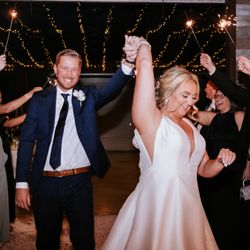 iSound - " Pure joy as the newlyweds make their grand exit under a sparkling canopy of love and celebration ."
