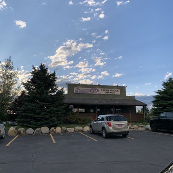 Spencer - a parking lot with cars parked in front of it - Steakhouses Near Me - Kalispell, Montana Spencer - a parking lot with cars parked in front of it - Steakhouses Near Me - Kalispell, Montana