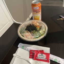 Salmon, Tuna, crab salad, avocado, seaweed salad, nori, furikake, masago, garlic chips,  & creamy yuzu togarashi