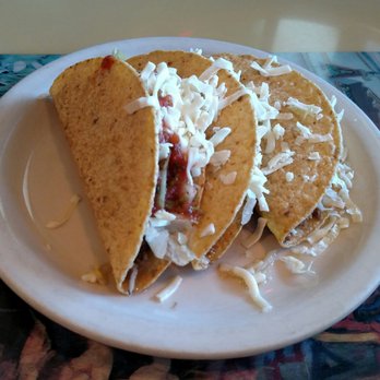 Mi Zarape Mexican Restaurant - Plate of three crunchy ground beef tacos with lettuce and cheese. Delicious! - Mexican Near Me - Saline, Michigan