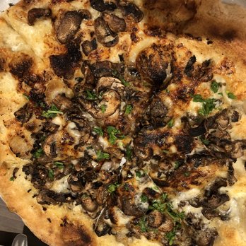 Elemental Pizza - The Truffled Mushroom: garlic oil, crimini mushrooms, fontal, & Parmesan finished with parsley & truffle oil - Pizza Near Me - Seattle, Washington Elemental Pizza - The Truffled Mushroom: garlic oil, crimini mushrooms, fontal, & Parmesan finished with parsley & truffle oil - Pizza Near Me - Seattle, Washington