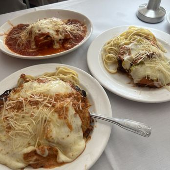 Mare e Monte - Back: lasagna, front: chicken parm, right: veal parm - Italian Near Me - San Antonio, Texas Mare e Monte - Back: lasagna, front: chicken parm, right: veal parm - Italian Near Me - San Antonio, Texas