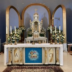 Saint Raymond of Penafort Catholic Church - Altar decorated with Easter flowers.