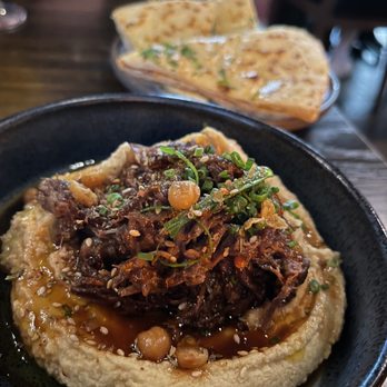 Sparrow + Wolf - OXTAIL HUMMUS, CRISPY CHICKPEAS, CURRY OIL, WARM NAAN - New American Near Me - Las Vegas, Nevada Sparrow + Wolf - OXTAIL HUMMUS, CRISPY CHICKPEAS, CURRY OIL, WARM NAAN - New American Near Me - Las Vegas, Nevada