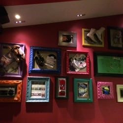 TGI Fridays UK - A wall of "stuff" .. and this is just one of many. music and movie posters. 80's toys etc..  lots of kitch stuff too.