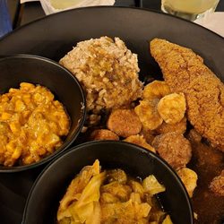 Curry Shrimp plate with fried catfish, smothered cabbage & corn maque choux. So freaking good!