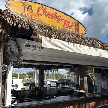 Wind Safe Hurricane Protection - Custom roll-down hurricane shutter system installed for Cheeky Tiki near Lely Resort in Naples, FL - Windows Installation Near Me - Naples, Florida