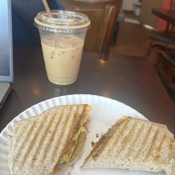 The Coffee Shop - Iced vanilla latte with oat milk and egg, cilantro, spinach and cheddar wrap - Coffee & Tea Near Me - Brooklyn, New York The Coffee Shop - Iced vanilla latte with oat milk and egg, cilantro, spinach and cheddar wrap - Coffee & Tea Near Me - Brooklyn, New York