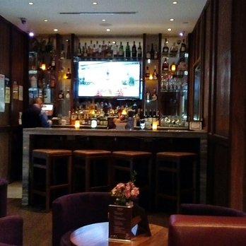 Premier Lounge - a bar with a television in the background - Lounges Near Me - New York, New York Premier Lounge - a bar with a television in the background - Lounges Near Me - New York, New York
