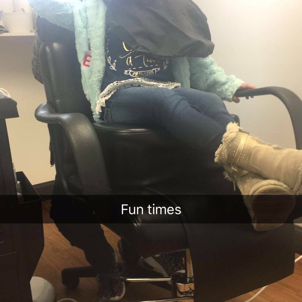 Daughter getting her hair combed out Daughter getting her hair combed out