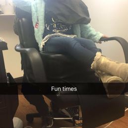 Daughter getting her hair combed out