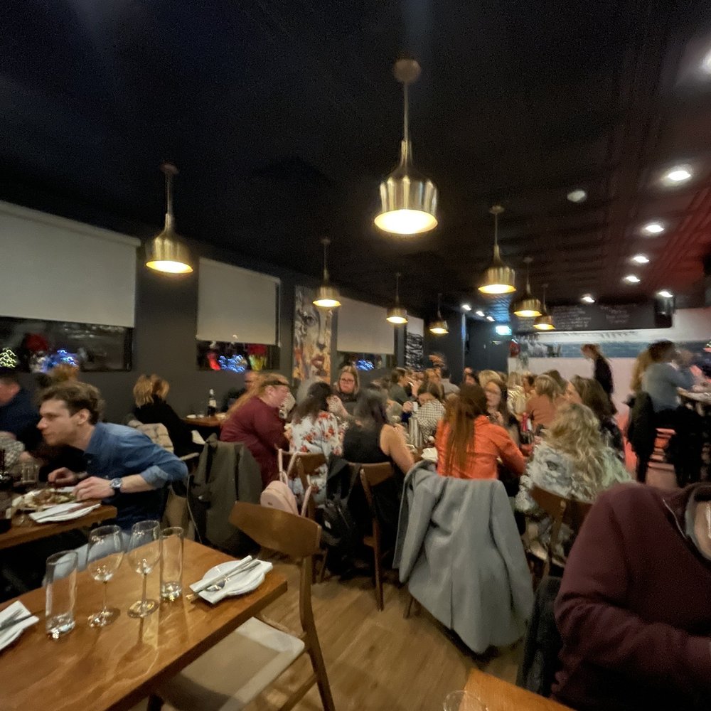 Le Marlow - a large group of people sitting at tables in a restaurant - French Near Me - Saint-Hubert, Quebec Le Marlow - a large group of people sitting at tables in a restaurant - French Near Me - Saint-Hubert, Quebec
