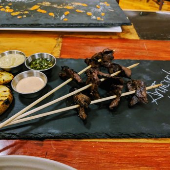 Aji Restaurant - anticuchos (grilled beef heart slices). a perfect delivery vehicle for 3!!! dipping sauces - Latin American Near Me - Taos, New Mexico Aji Restaurant - anticuchos (grilled beef heart slices). a perfect delivery vehicle for 3!!! dipping sauces - Latin American Near Me - Taos, New Mexico