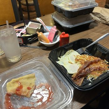 Denny's - Part of one of the vanilla crepes on the left and 2 more take home boxes of Crepes and Evgs and stuff for later that night. - American Near Me - Pico Rivera, California