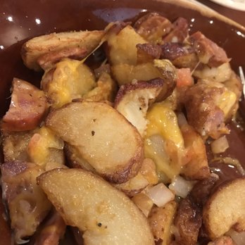 Another Broken Egg Cafe - Potato selection with andouille sausage, onions and tomato - Breakfast & Brunch Near Me - Pearland, Texas