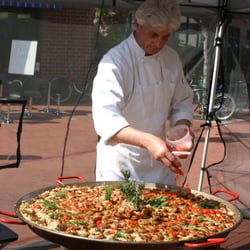 The Black Sheep Cooking Club - Chef Rick puts on the finishing touches for a demonstration paella at The Lido Farmer's Market.