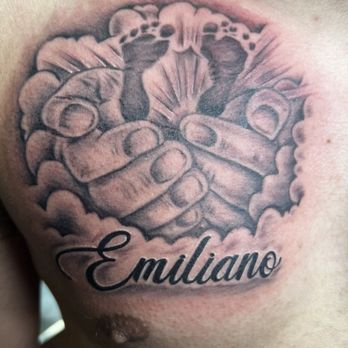 Pacific Ave Tattoo - my sons feet in his fathers exact hands with clouds & sun rays - Tattoo Near Me - Tacoma, Washington Pacific Ave Tattoo - my sons feet in his fathers exact hands with clouds & sun rays - Tattoo Near Me - Tacoma, Washington