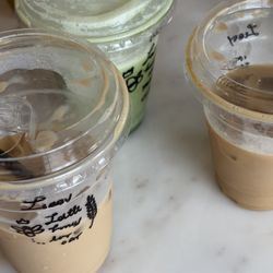 Village Coffee - Iced latte with oat milk, lavender, & honey (half sweet)