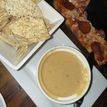 The White Rabbit - Queso and chips and a pepperoni flatbread - Cocktail Bars Near Me - Gilbert, Arizona The White Rabbit - Queso and chips and a pepperoni flatbread - Cocktail Bars Near Me - Gilbert, Arizona