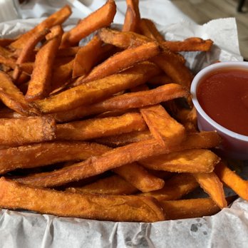 Kickin Seafood Cajun Style. - a basket of sweet potato fries - Cajun/Creole Near Me - Orem, Utah