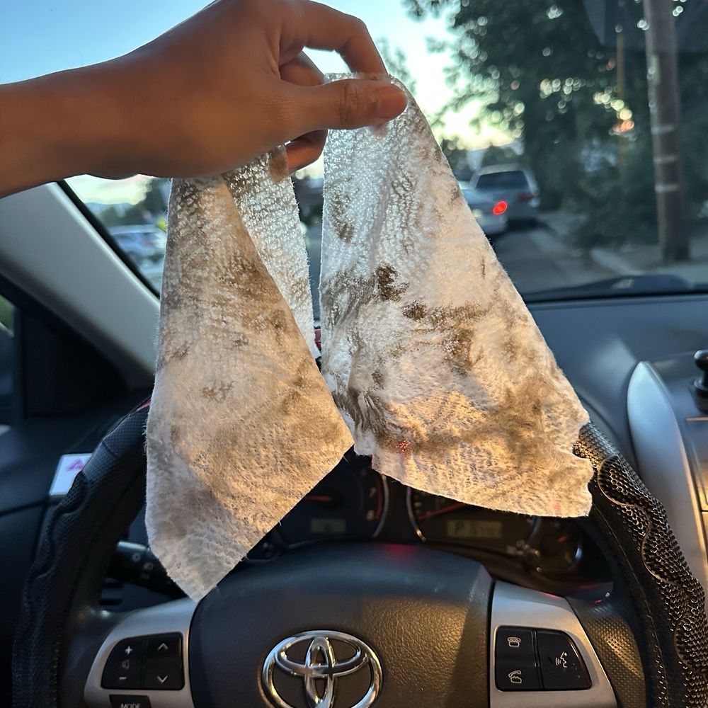 AAA Mobile Detail - 2 clorox wipes -- after rubbing the steering wheel, proof that it's still super dirty. - Auto Detailing Near Me