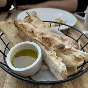 OSTE - Complimentary bread with olive oil.  The bread is meh. - Italian Near Me - Los Angeles, California