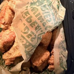 Wingstop - Garlic parm classic wings on top of plain boneless wings