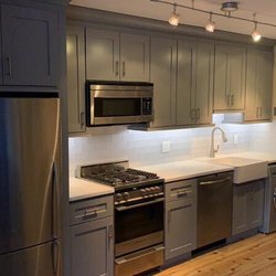 In House Kitchen Design - Shaker style cabinets in gray, with under cabinet lighting. We are in love!